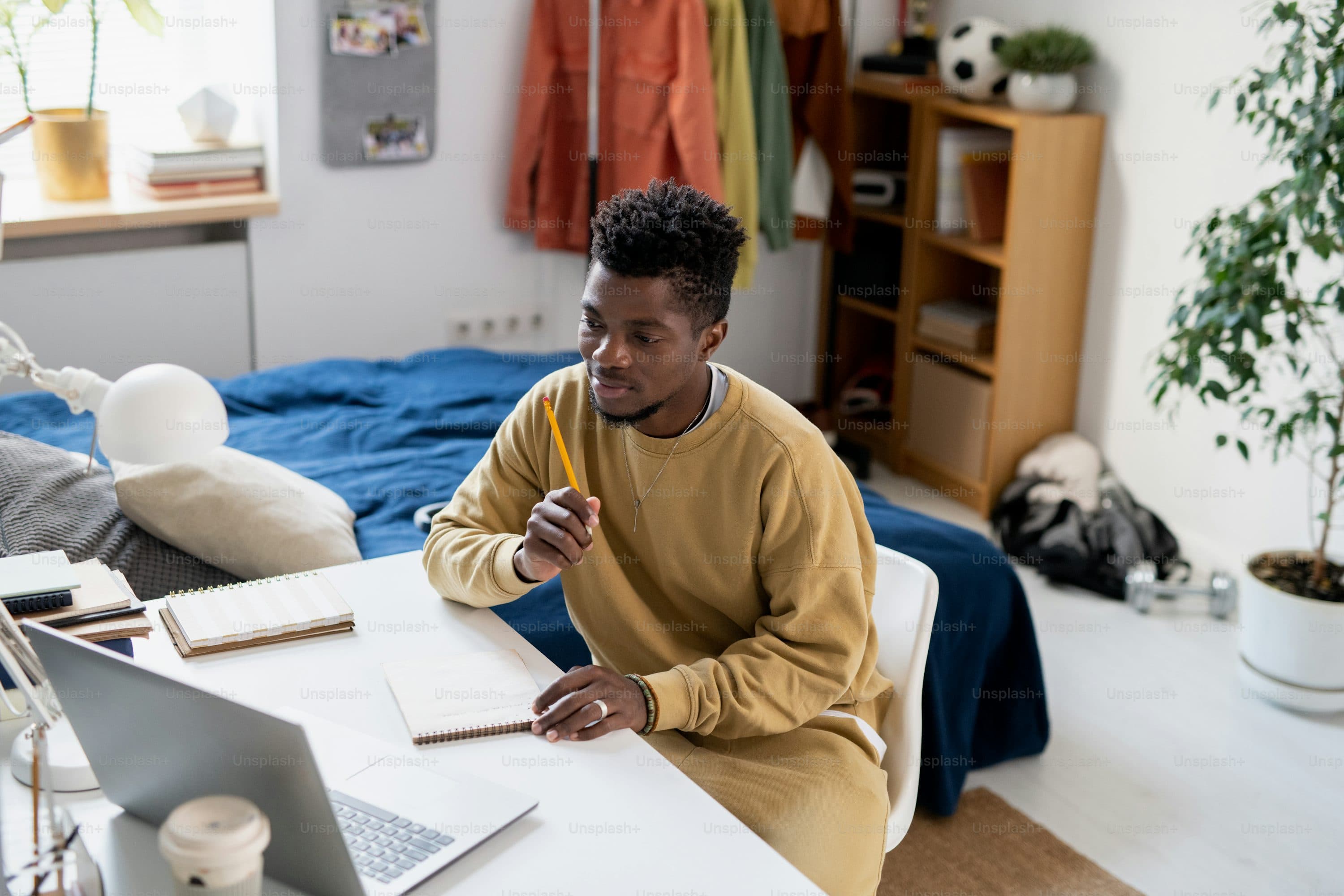 Student waving on a video call